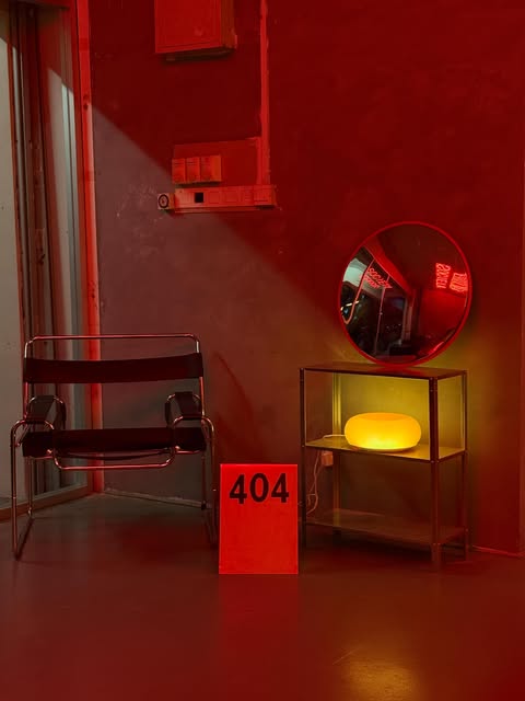 Crimson-lit lounge corner at 404 Coffee