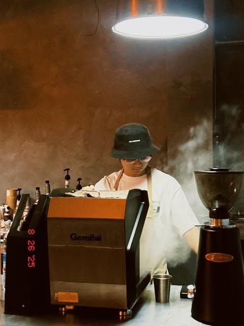 Barista at the espresso machine